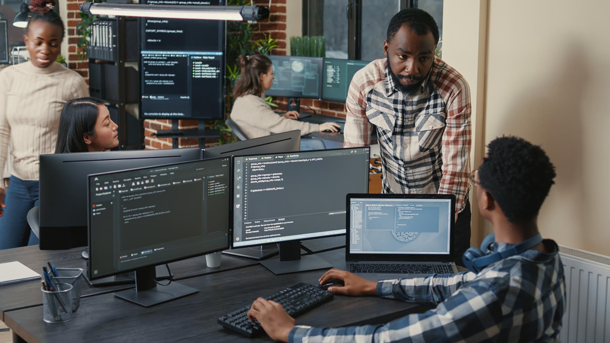 Designer and developer reviewing a professional website experience
