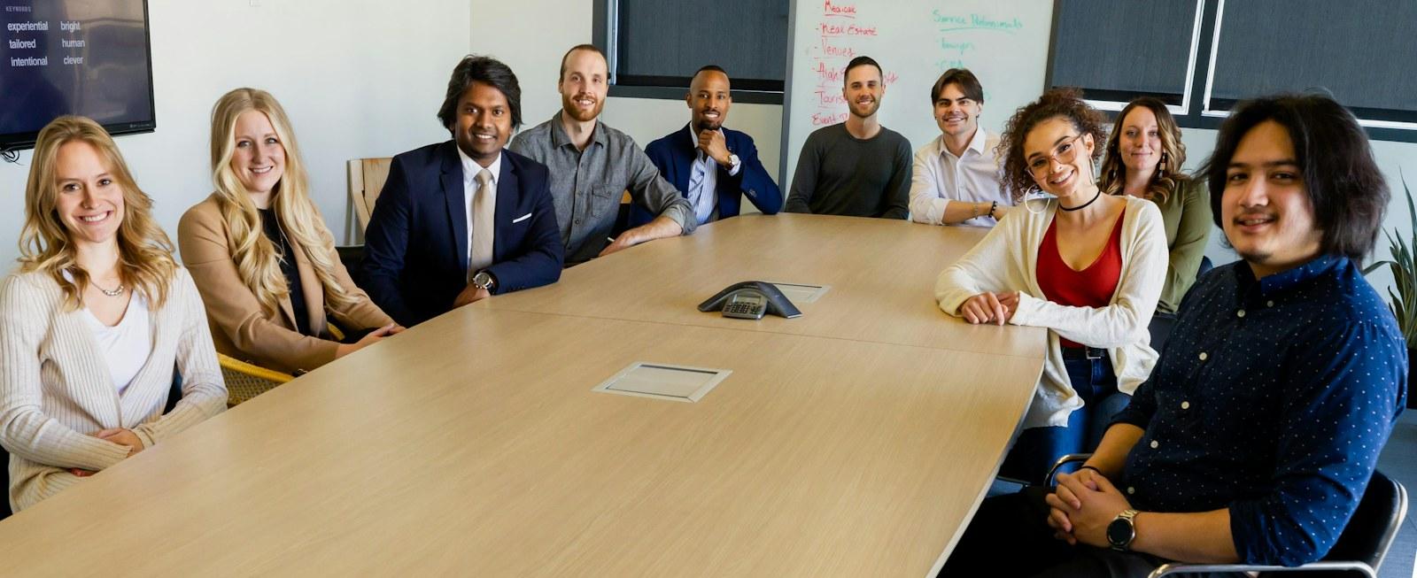 Business team reviewing work together around a table