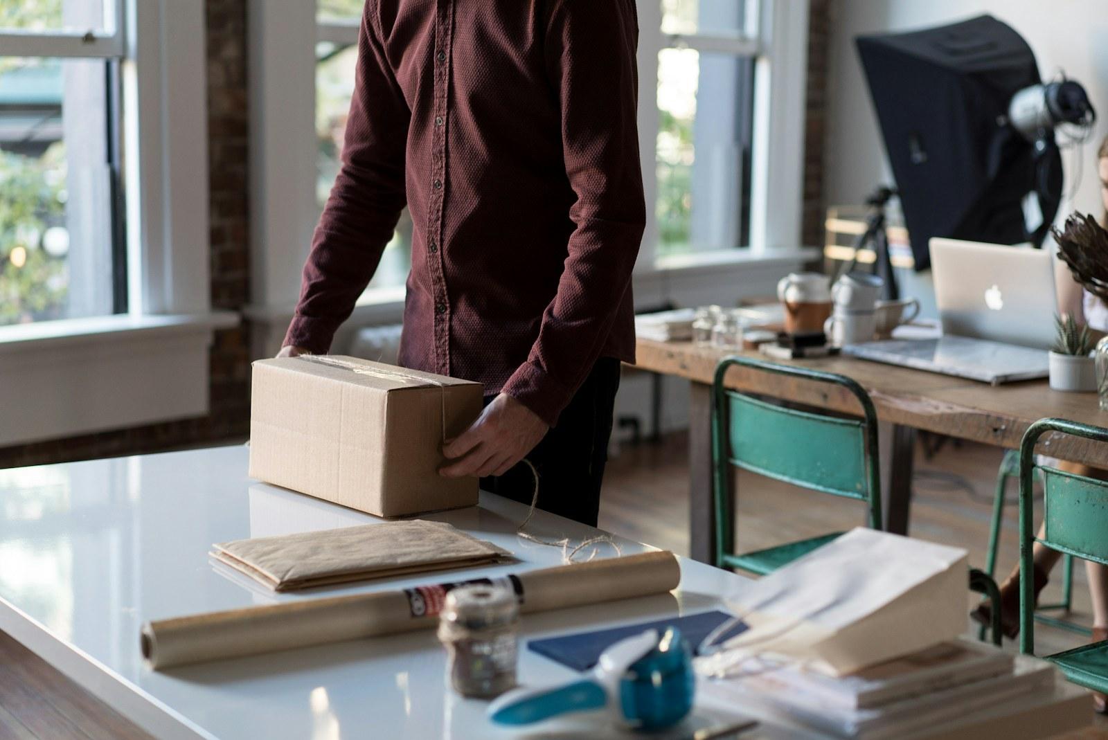 Retail order being packed into a cardboard box