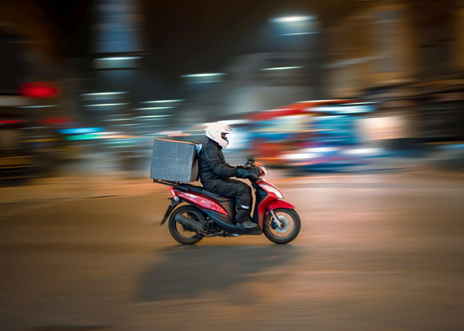 Delivery rider travelling through a city