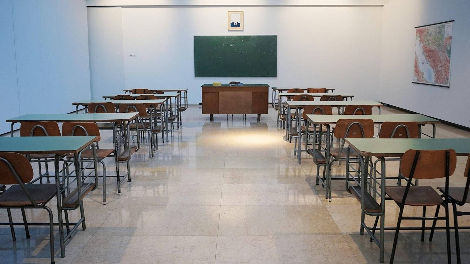 Classroom with desks and a chalkboard