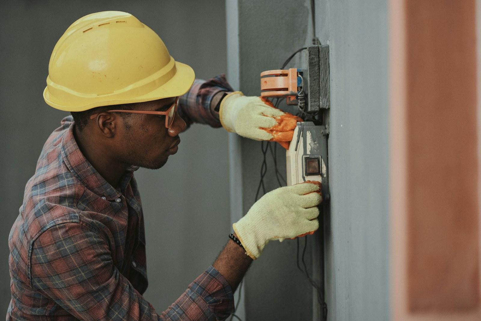 Field technician installing electrical wiring